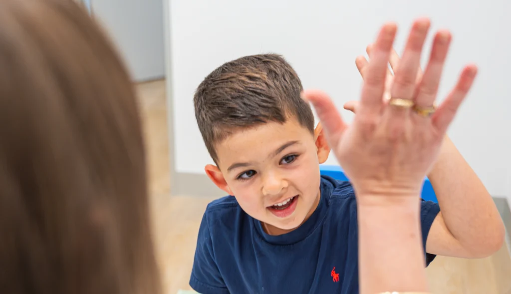 Toddler using new words during play-based language therapy at the Balmain clinic