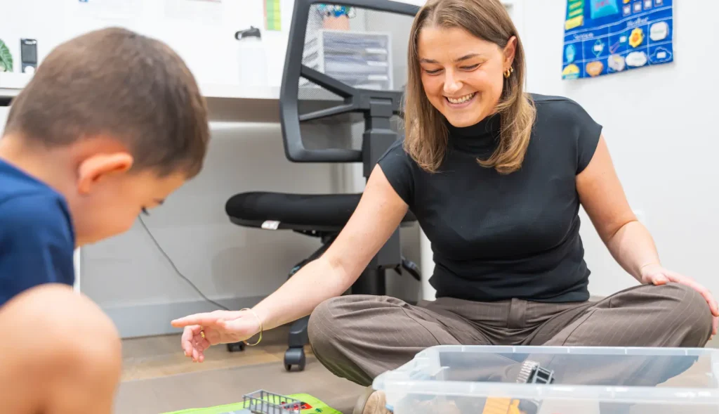 Speech pathologist guiding a parent on home language strategies in Balmain
