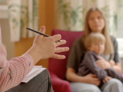 Speech Therapist and Child in a Play-Based Therapy Session